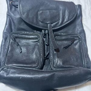 Doma Black Leather Drawstring Flap Backpack